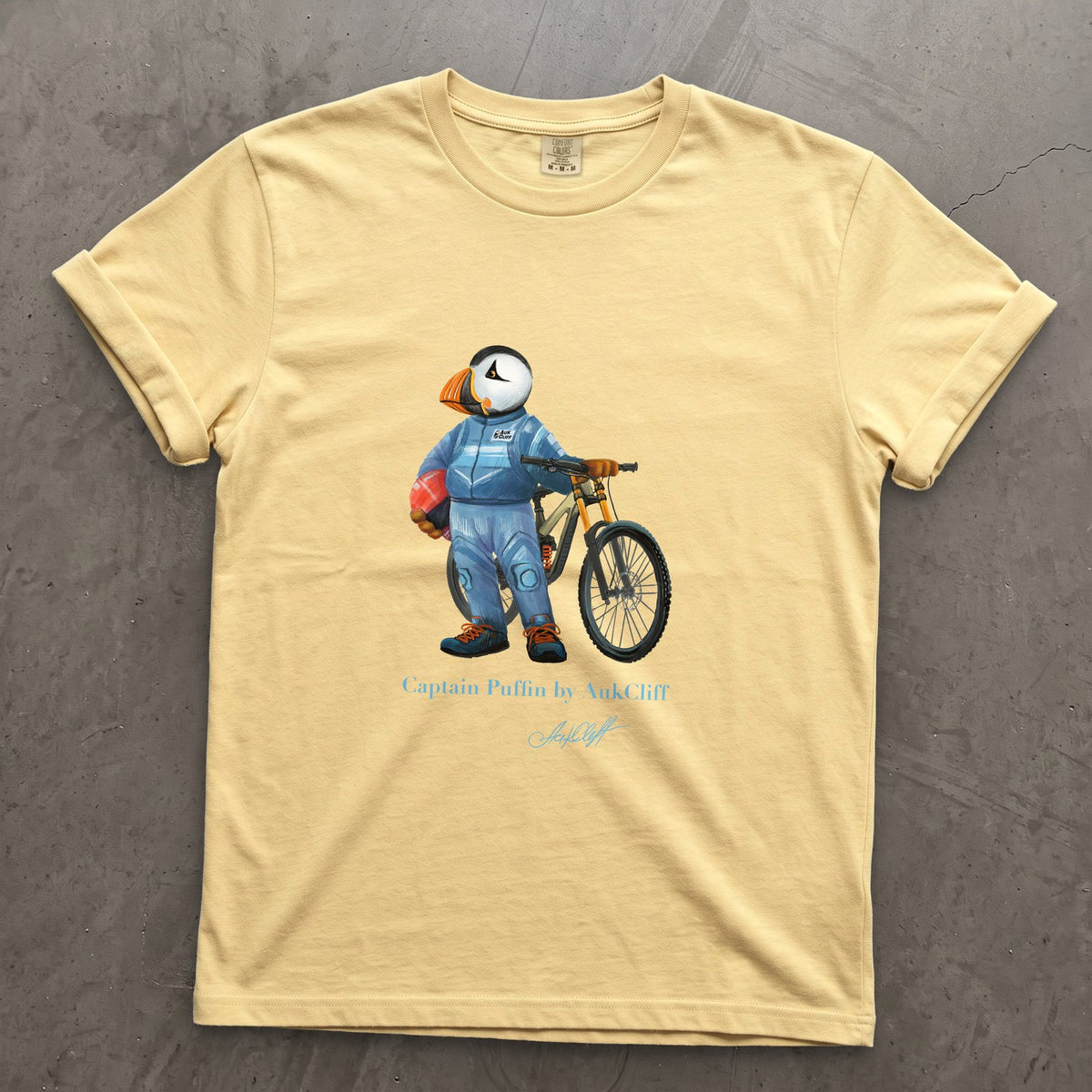 Captain Puffin Downhill Mountain Biker on a Butter Comfort Colors t-shirt