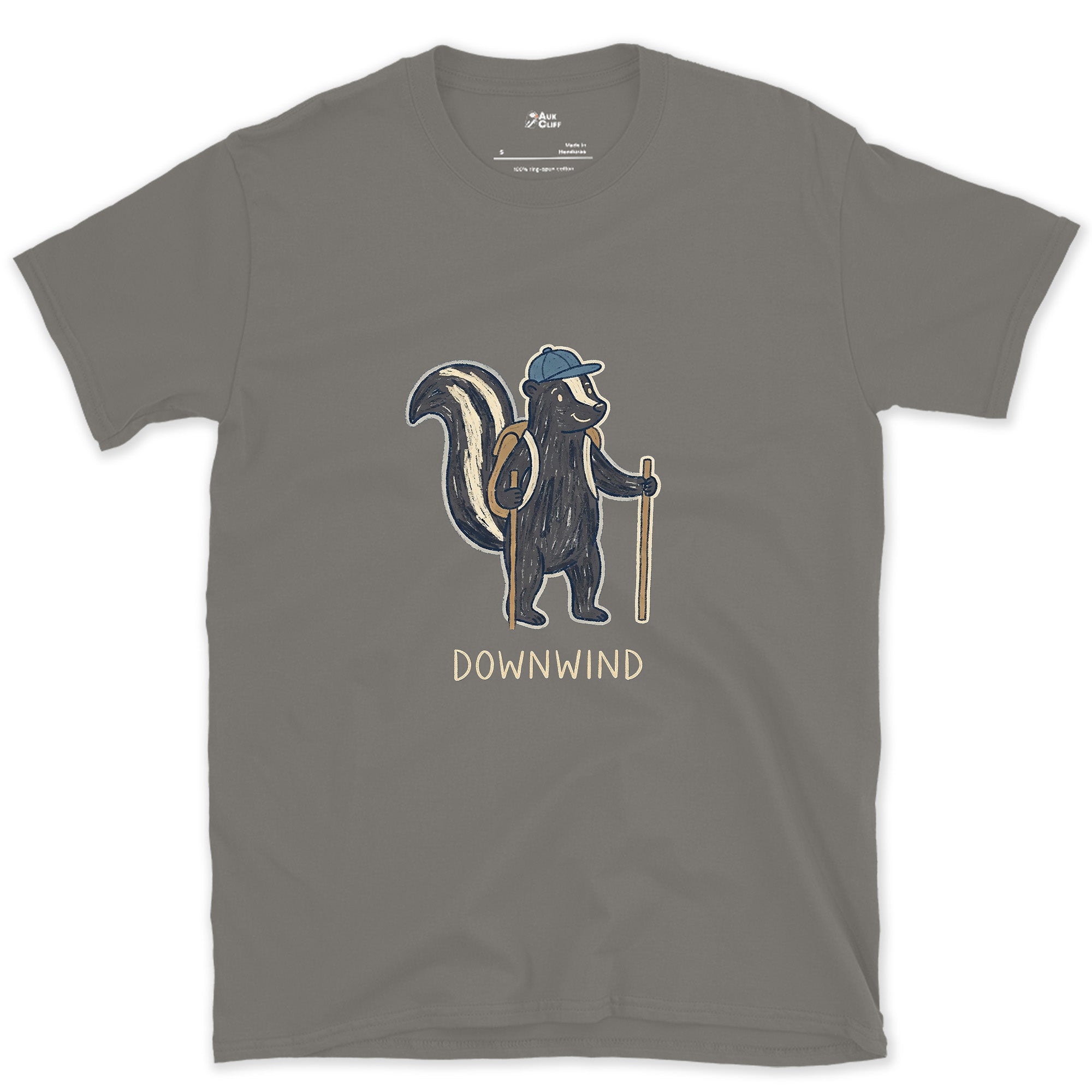 Downwind, Skunk Hiker on the Trail design on a Charcoal Gildan Softstyle t-shirt
