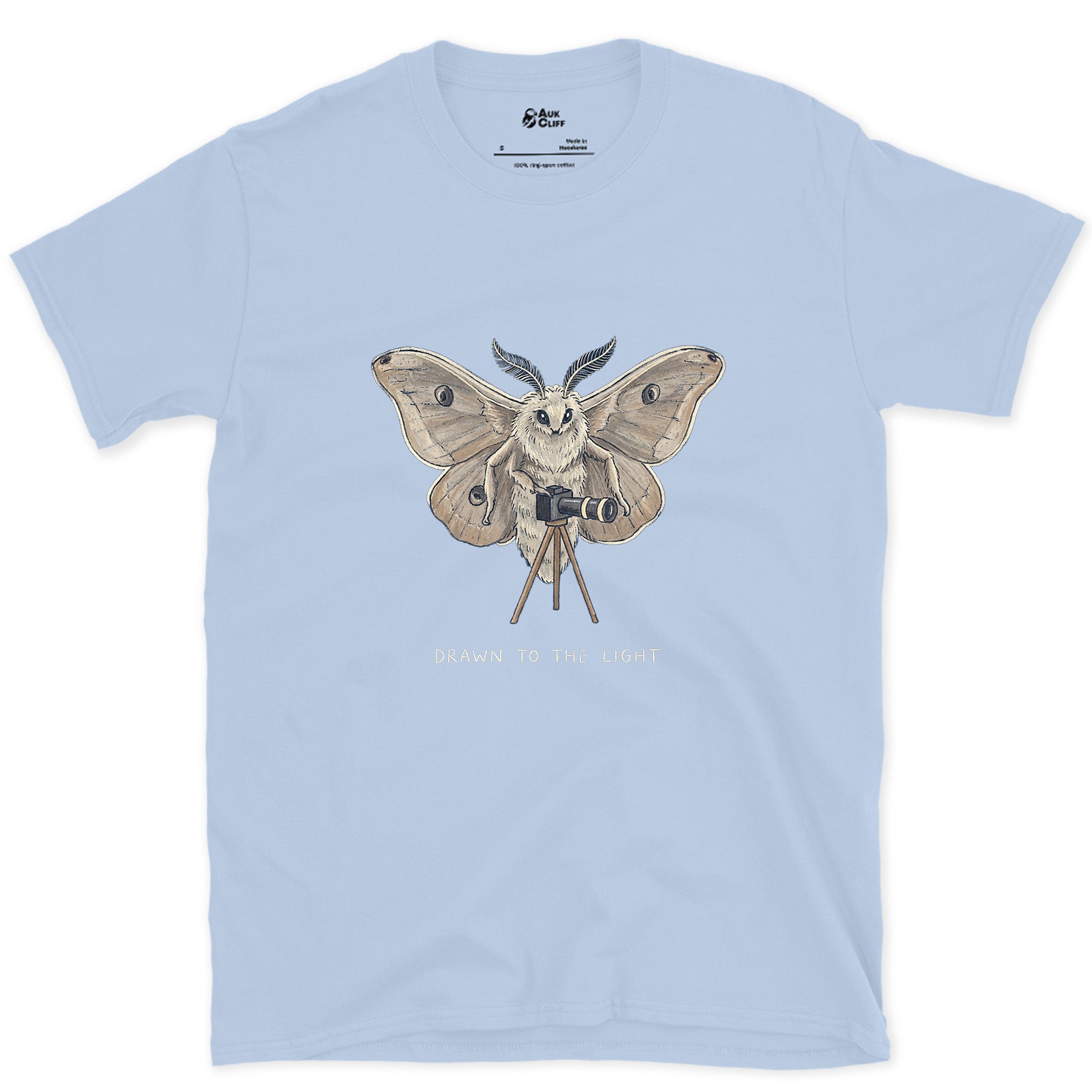 Drawn to the Light, Moth design on a Light Blue Gildan Softstyle t-shirt