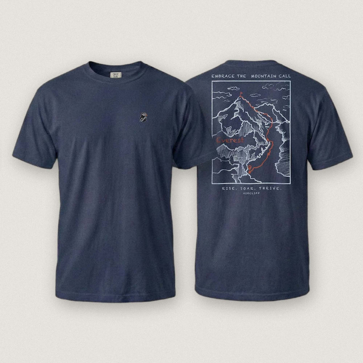 AukCliff Everest tee in True Navy, summit-route line art across the back
