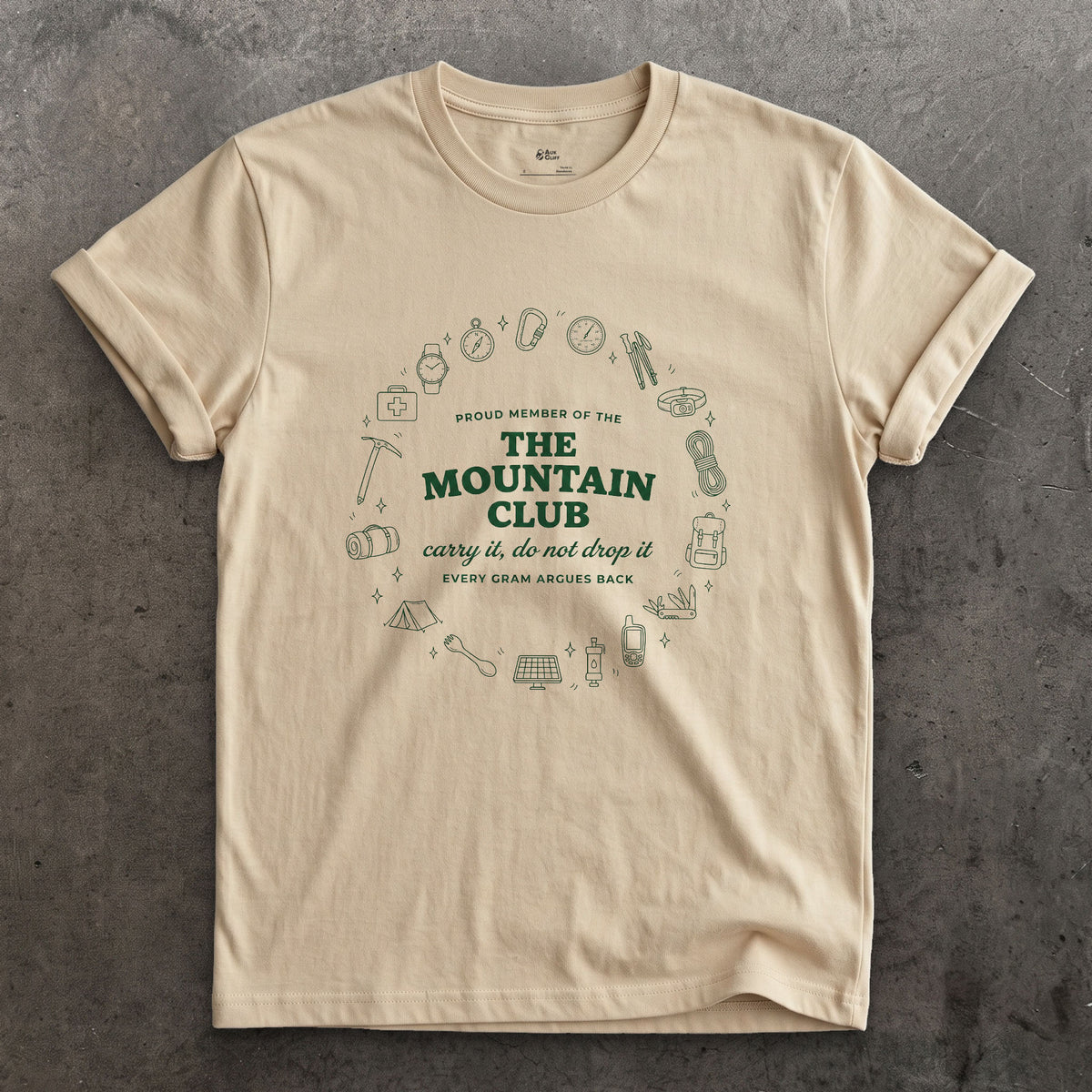Carry It, Do Not Drop It, the Mountain Argues Back design on a Sand Gildan Softstyle t-shirt