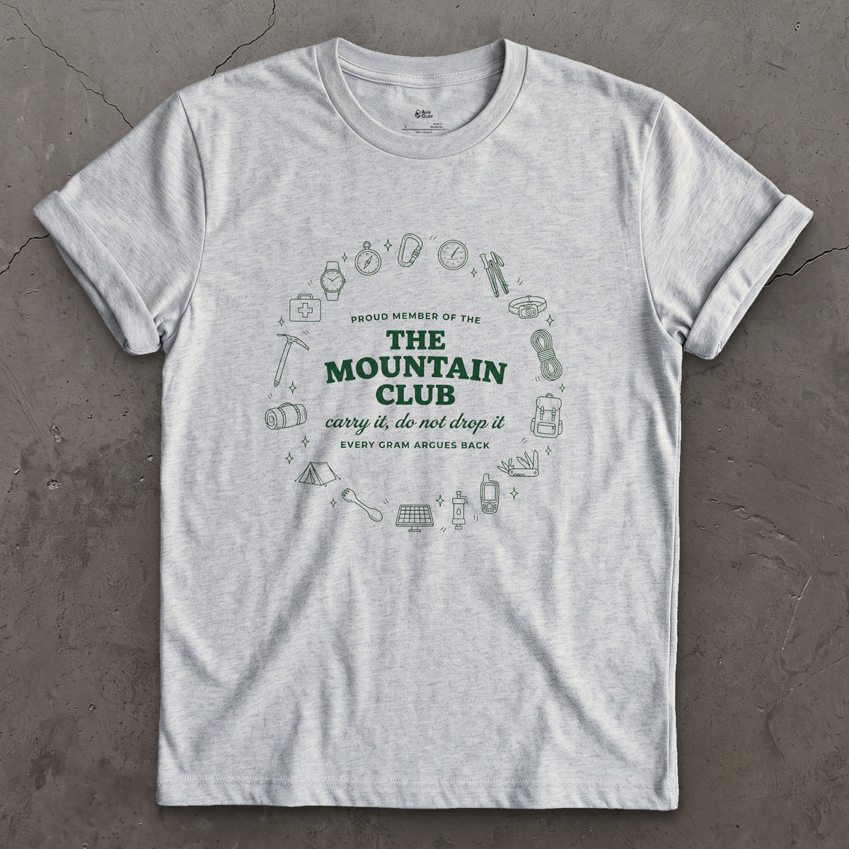 Carry It, Do Not Drop It, the Mountain Argues Back design on a Sport Grey Gildan Softstyle t-shirt