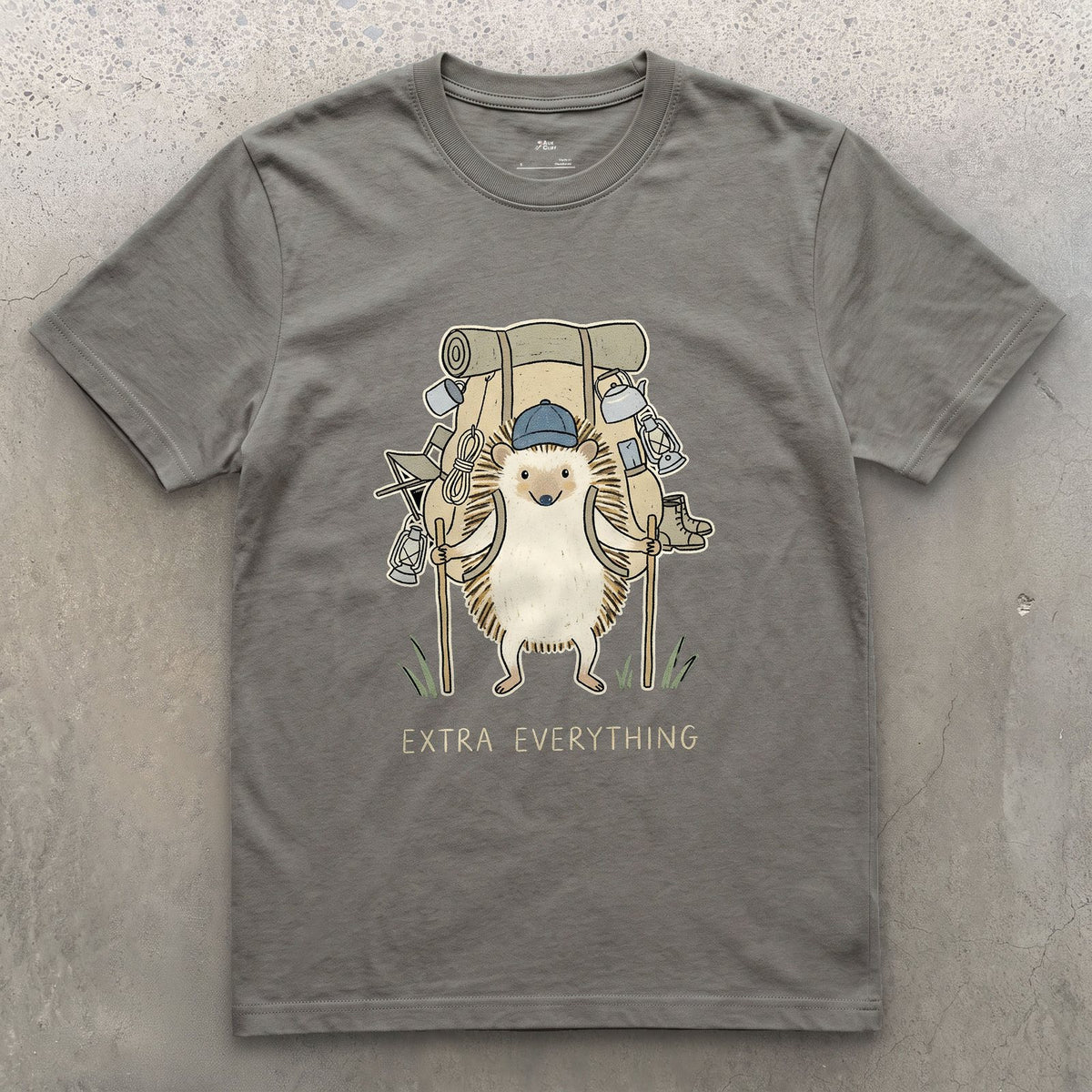 Never Packs Light, Hedgehog Hiker design on a Charcoal Gildan Softstyle t-shirt
