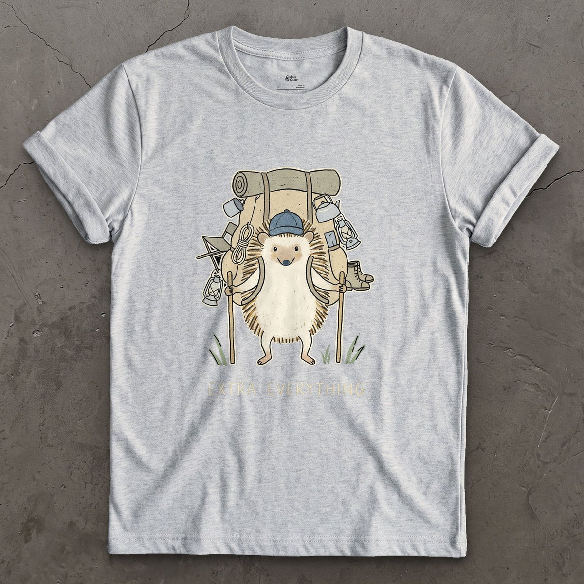 Never Packs Light, Hedgehog Hiker design on a Sport Grey Gildan Softstyle t-shirt