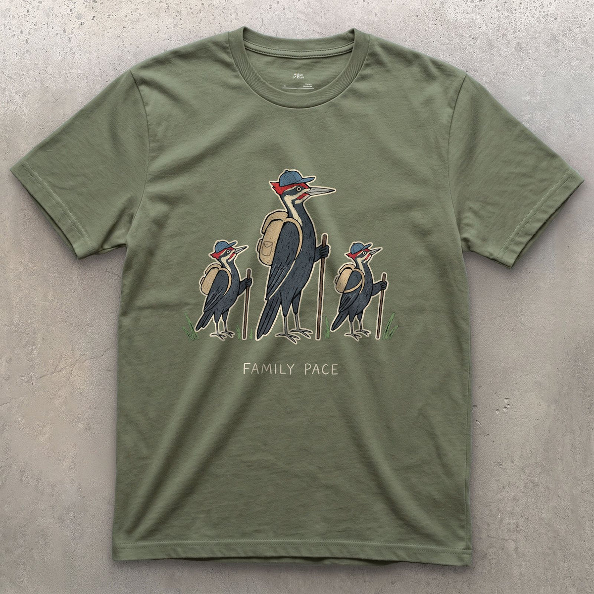 Woodpeckers Slowing to a Family Pace design on a Military Green Gildan Softstyle t-shirt