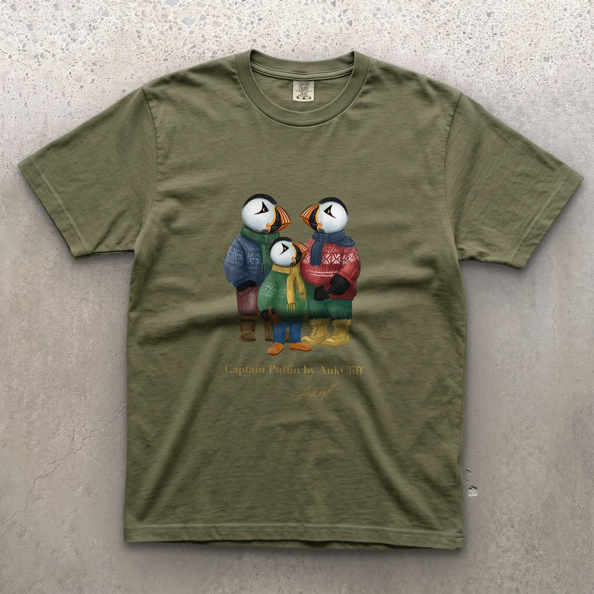 Captain Puffin Festive Family on a Moss Comfort Colors t-shirt