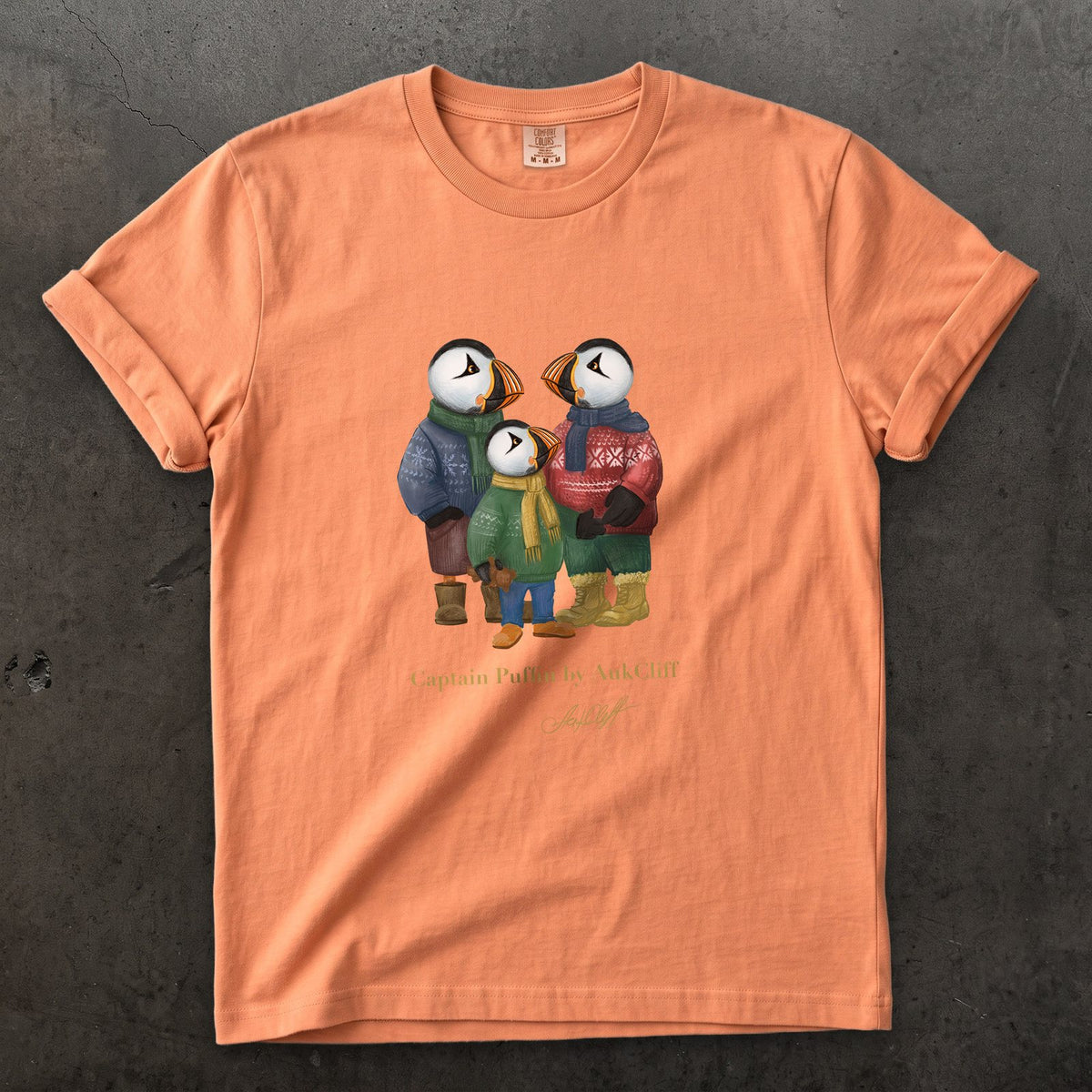 Captain Puffin Festive Family on a Terracotta Comfort Colors t-shirt
