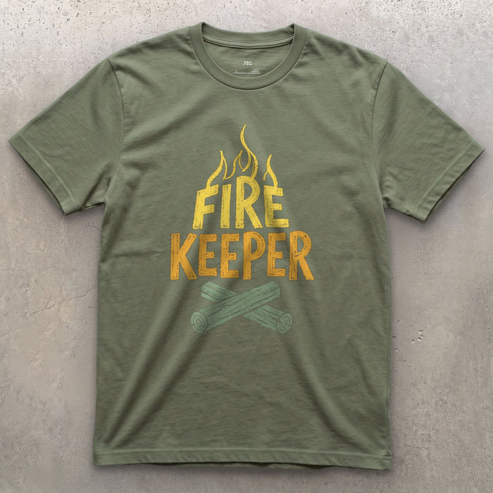 Fire Keeper, Crossed Logs at Camp design on a Military Green Gildan Softstyle t-shirt