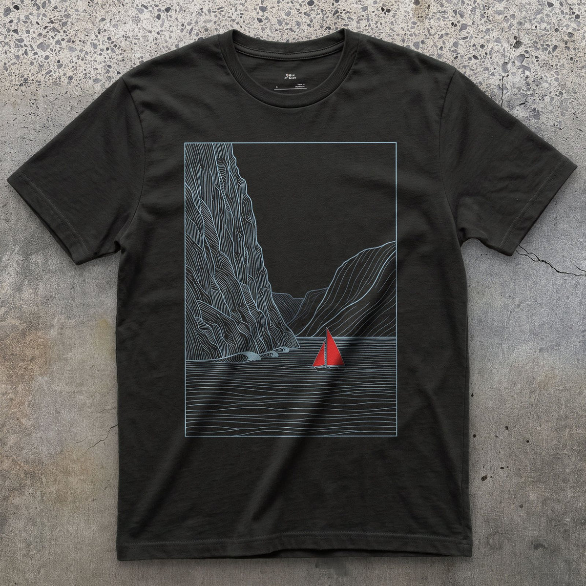Small Against the Mountain Fjord, Red Sailboat design on a Black Gildan Softstyle t-shirt