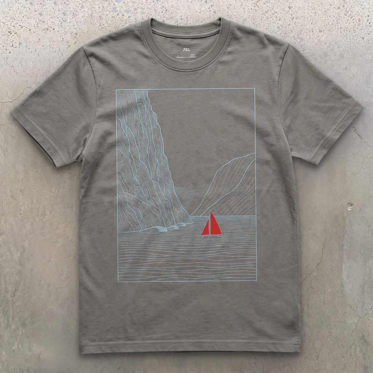 Small Against the Mountain Fjord, Red Sailboat design on a Charcoal Gildan Softstyle t-shirt