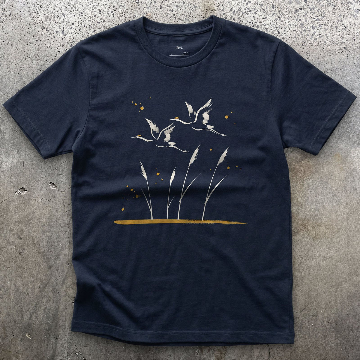 Flying Cranes and Reeds design on a Navy Gildan Softstyle t-shirt