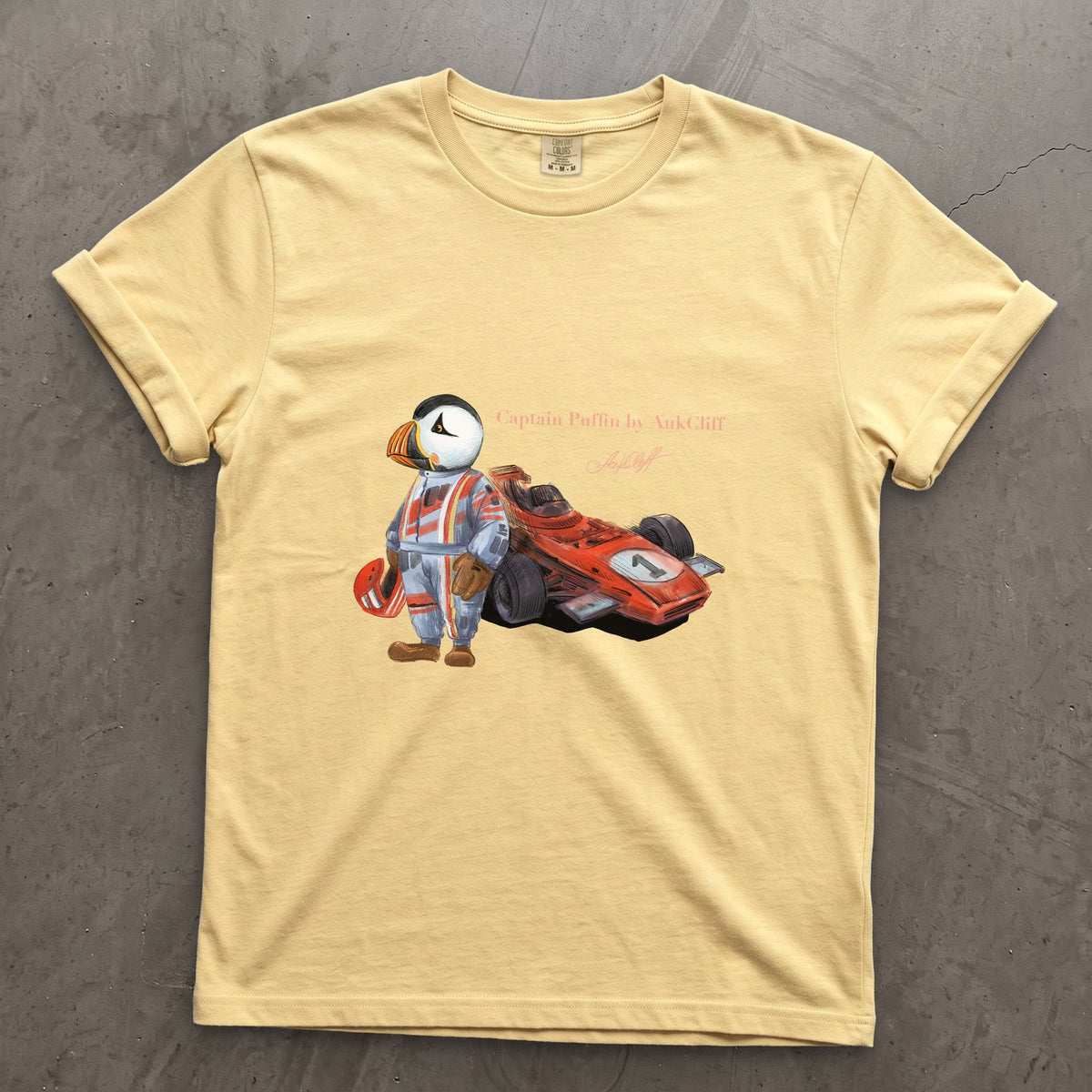 Captain Puffin Formula Racer on a Butter Comfort Colors t-shirt