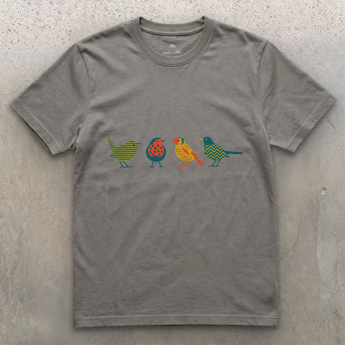 Four Birds in a Row, Each in Its Own Pattern design on a Charcoal Gildan Softstyle t-shirt