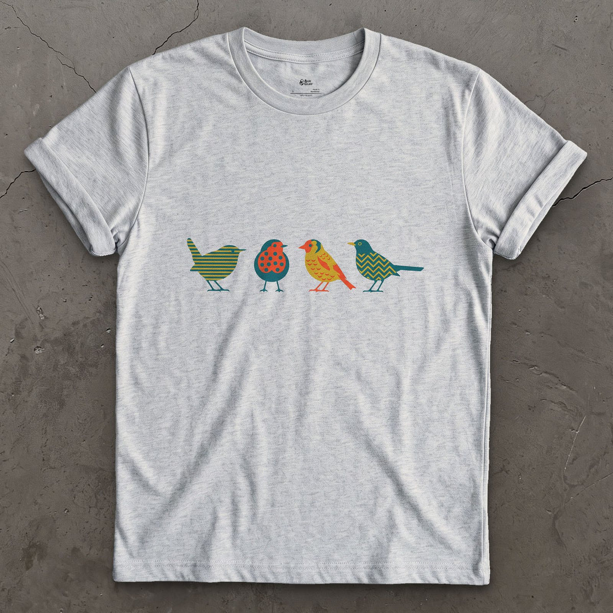 Four Birds in a Row, Each in Its Own Pattern design on a Sport Grey Gildan Softstyle t-shirt