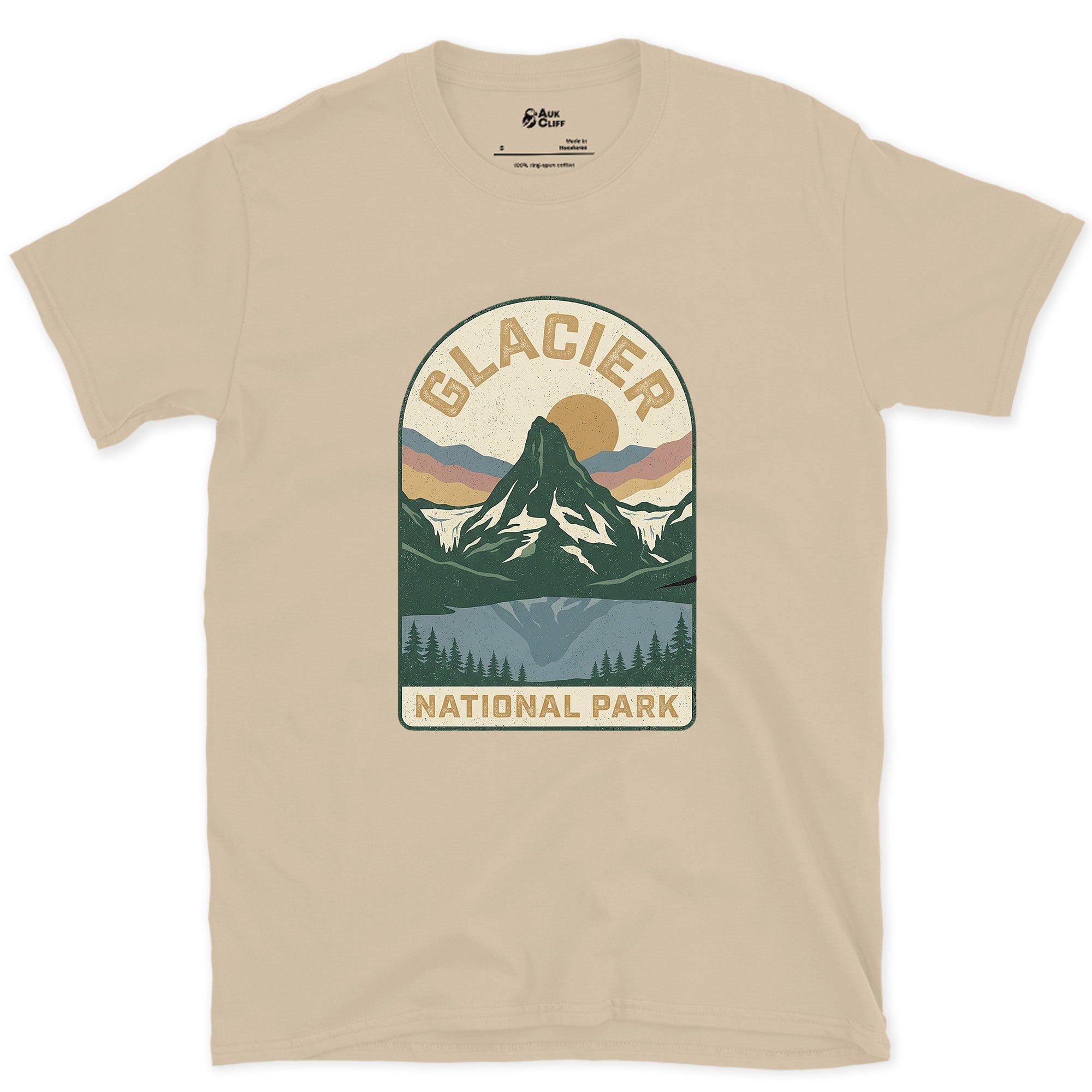 Glacier National Park Badge design on a Sand Gildan Softstyle t-shirt