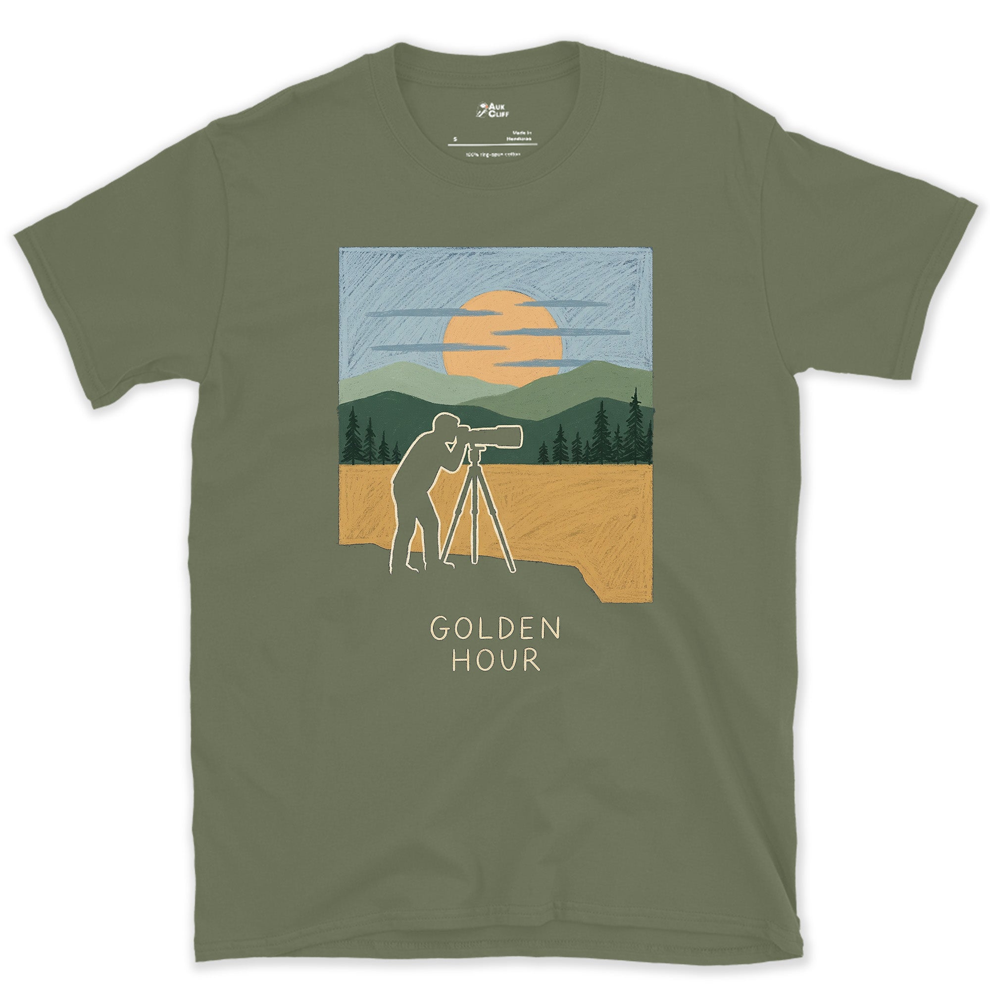 Postcard Perfect, Tripod on the Cliff Edge design on a Military Green Gildan Softstyle t-shirt