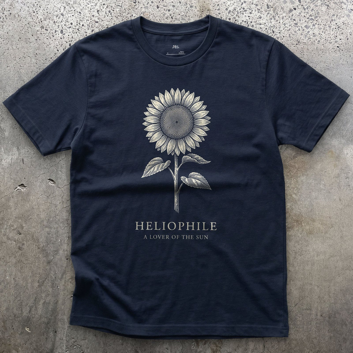 Heliophile design on a Navy Gildan Softstyle t-shirt