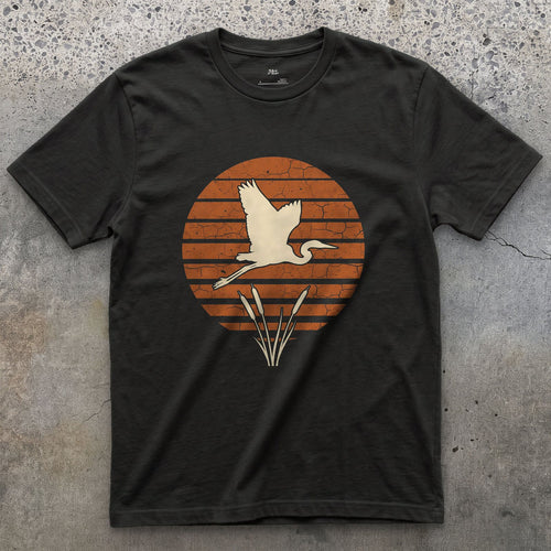 A Weathered Heron Against Rings of Colour design on a Black Gildan Softstyle t-shirt