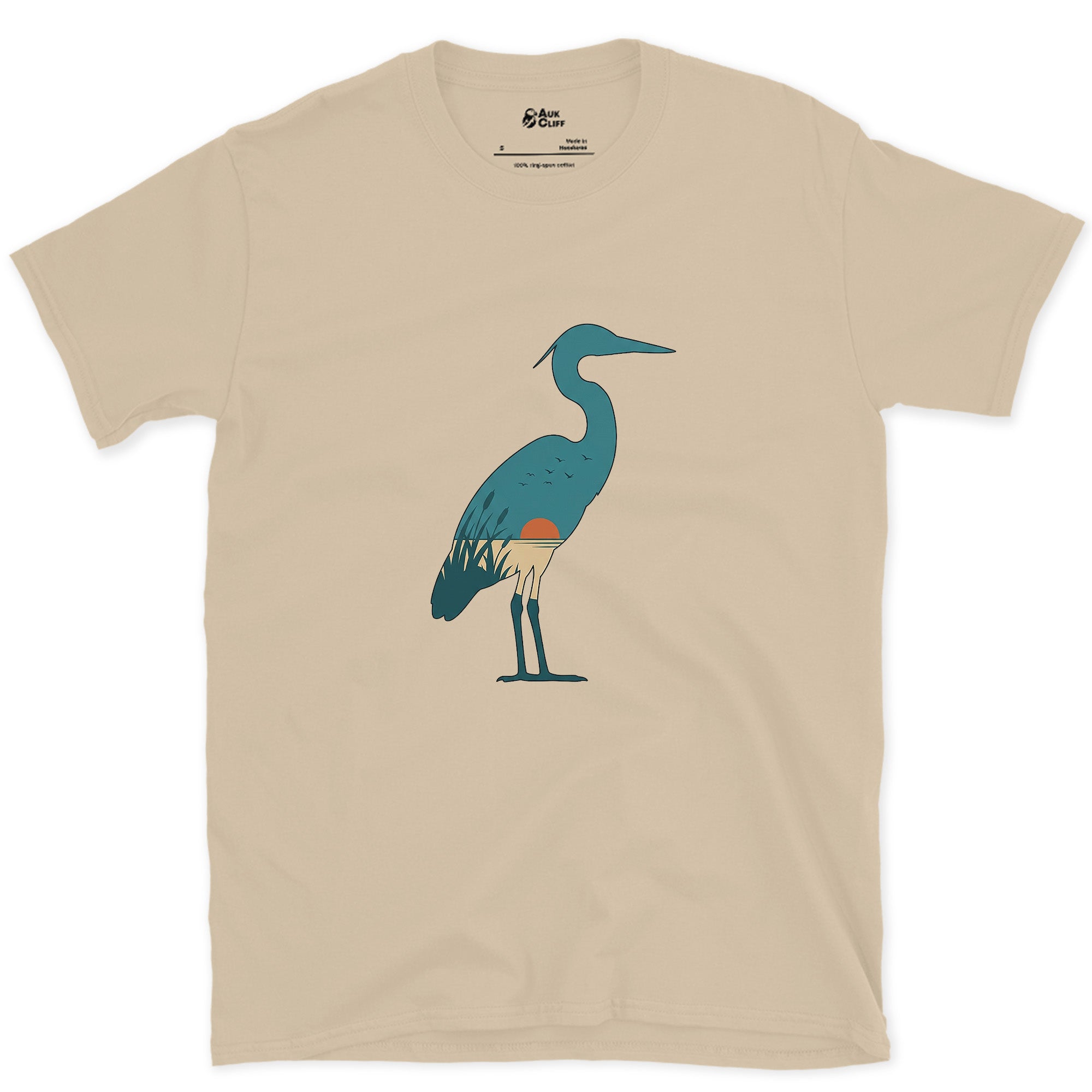 A Teal Heron Kept Flat Except at the Feet design on a Sand Gildan Softstyle t-shirt
