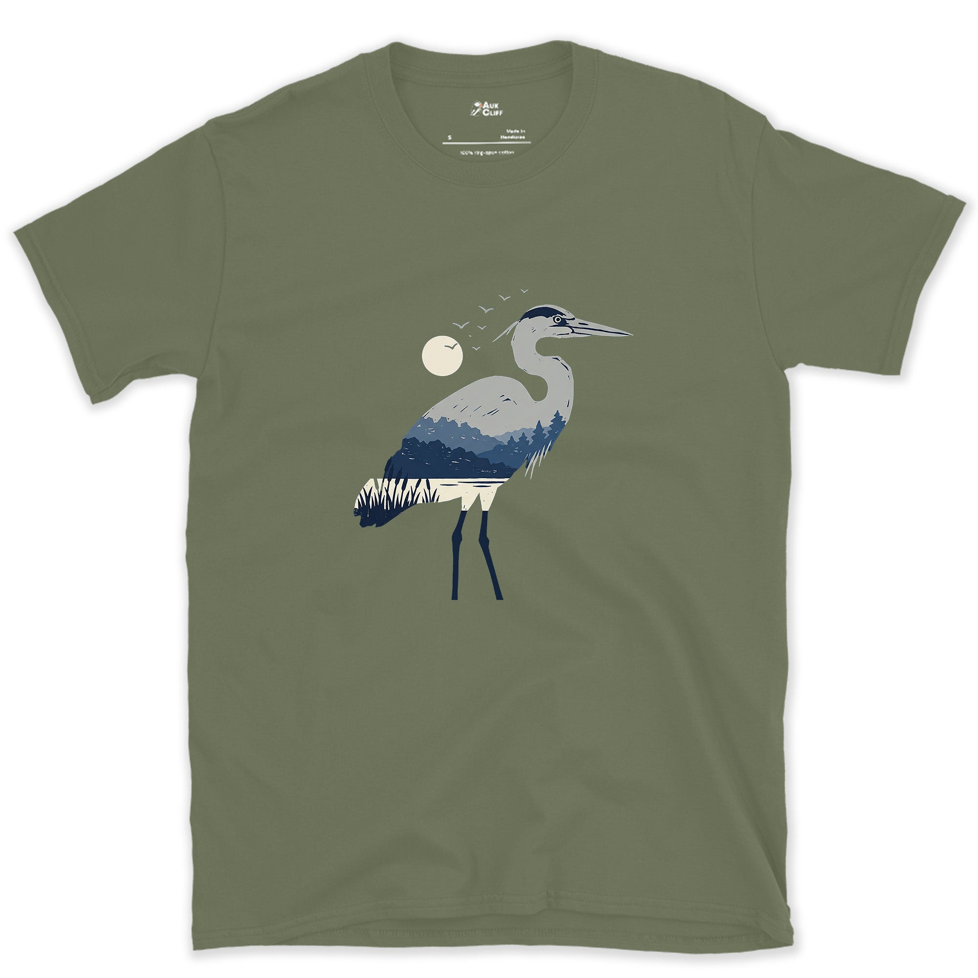 The Heron Holding a Whole Landscape Inside It design on a Military Green Gildan Softstyle t-shirt