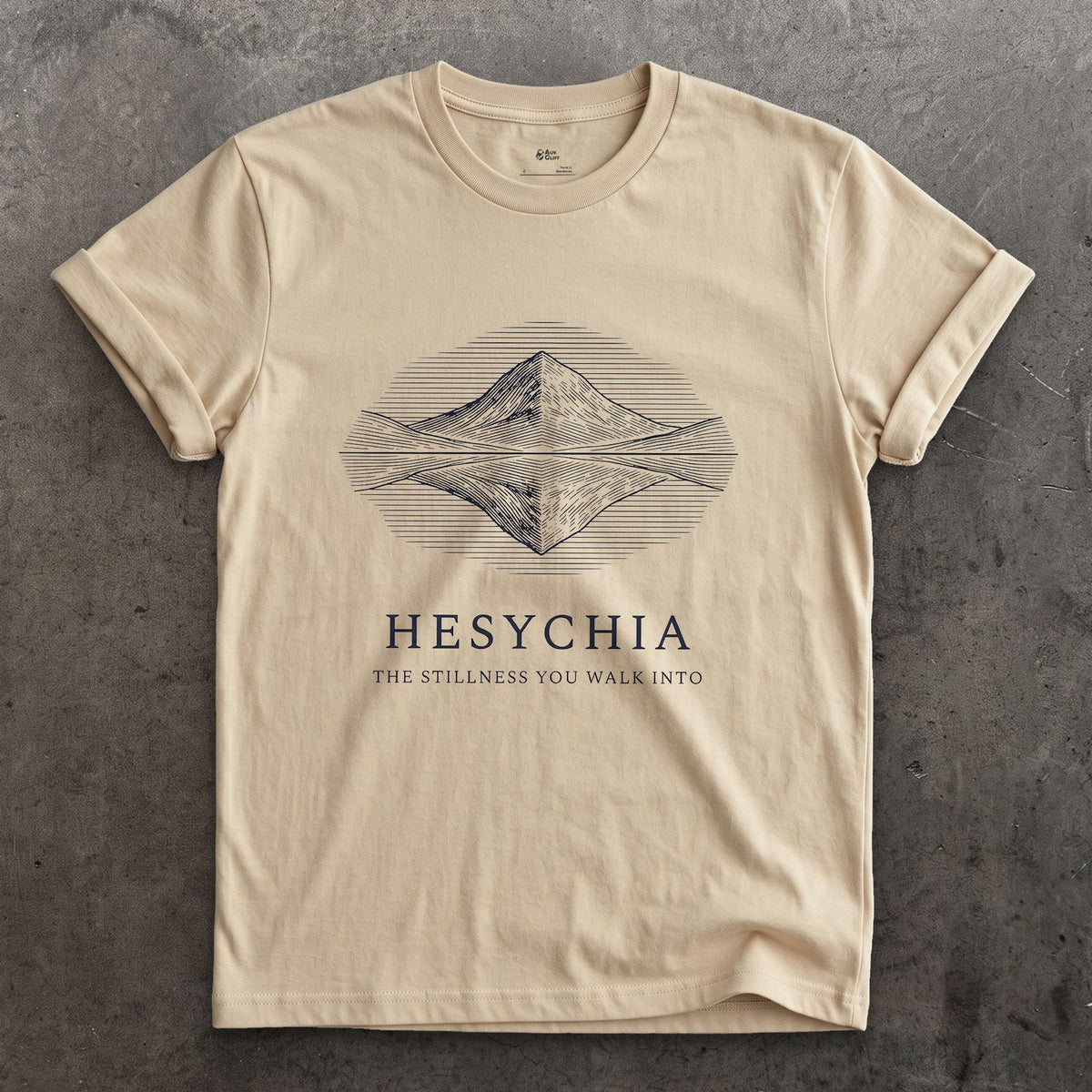 Hesychia, the Stillness You Walk Into design on a Sand Gildan Softstyle t-shirt