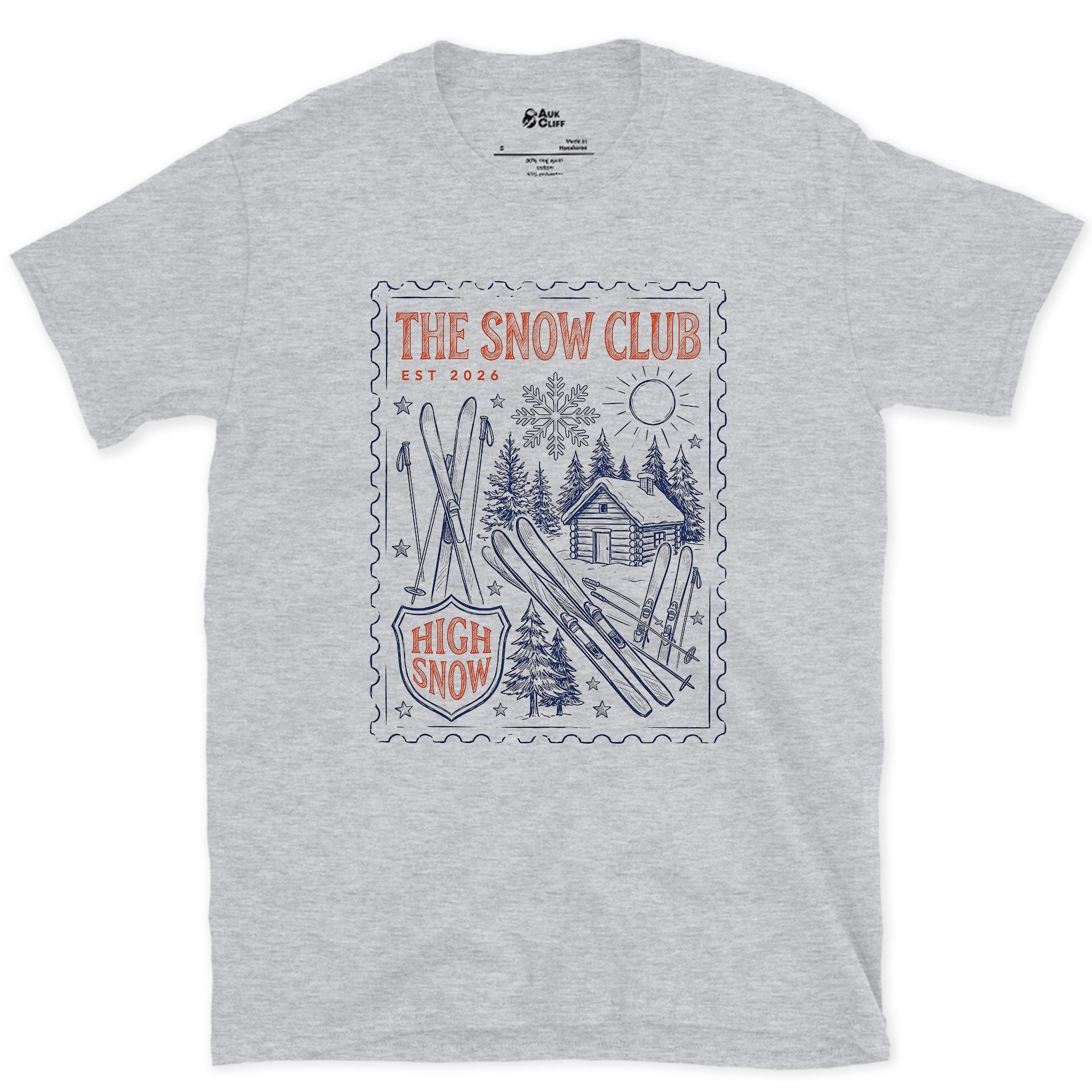 The Snow Club, Stamped With a Cabin and Skis design on a Sport Grey Gildan Softstyle t-shirt