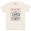 The Snow Club, Stamped With a Cabin and Skis design on a Natural Gildan Softstyle t-shirt
