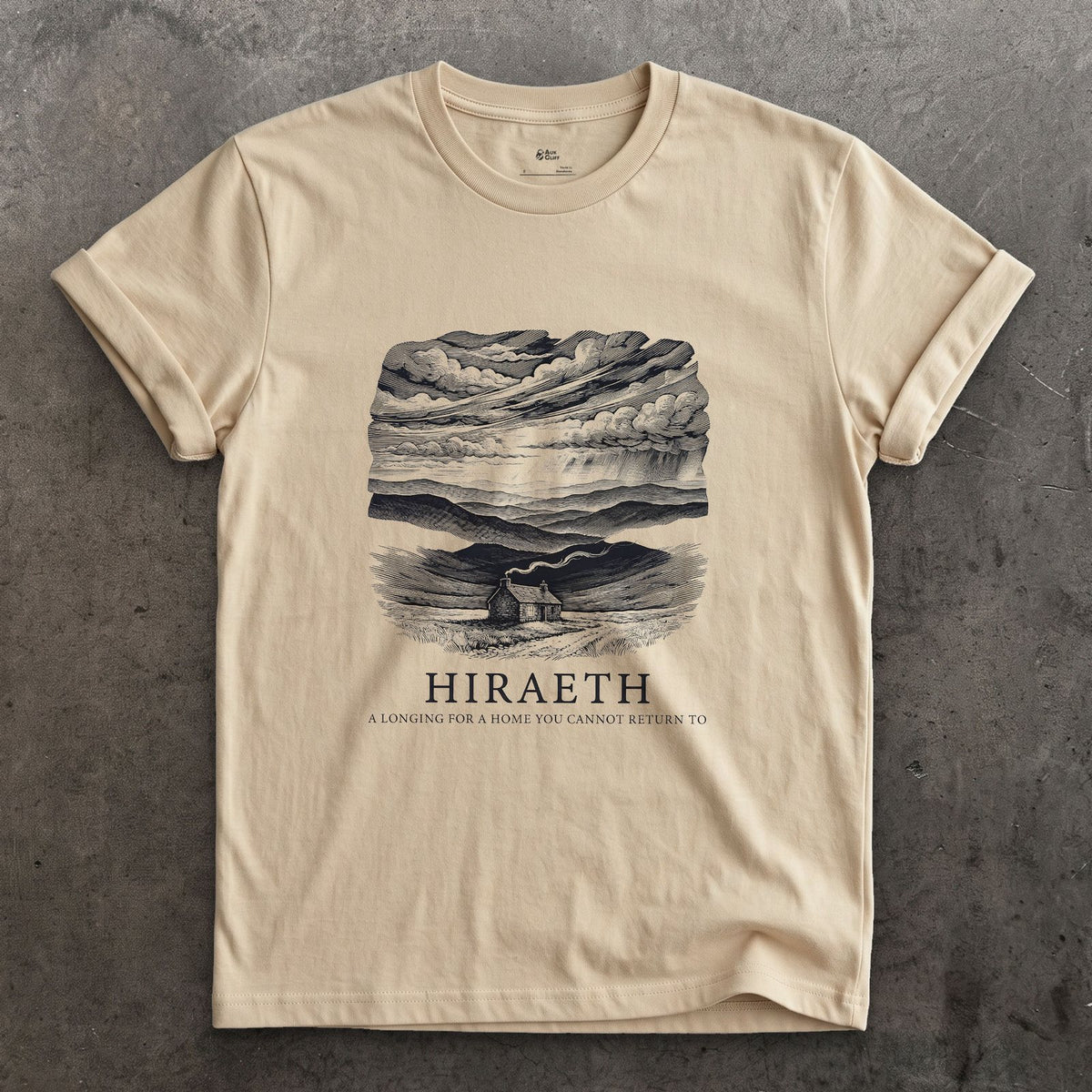 Hiraeth, a Longing for a Home You Cannot Return to design on a Sand Gildan Softstyle t-shirt