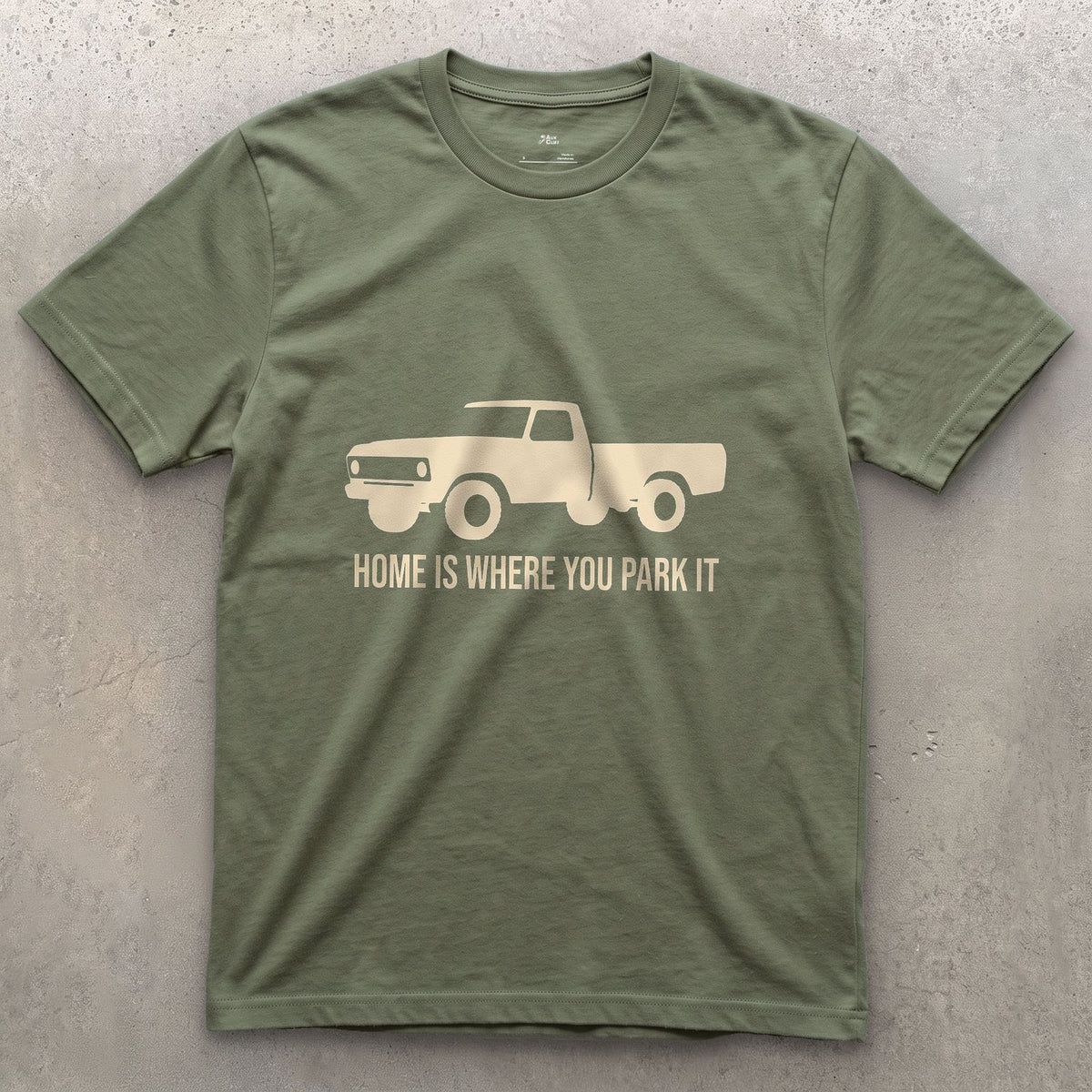Home Is Where You Park It, Truck and Tent design on a Military Green Gildan Softstyle t-shirt
