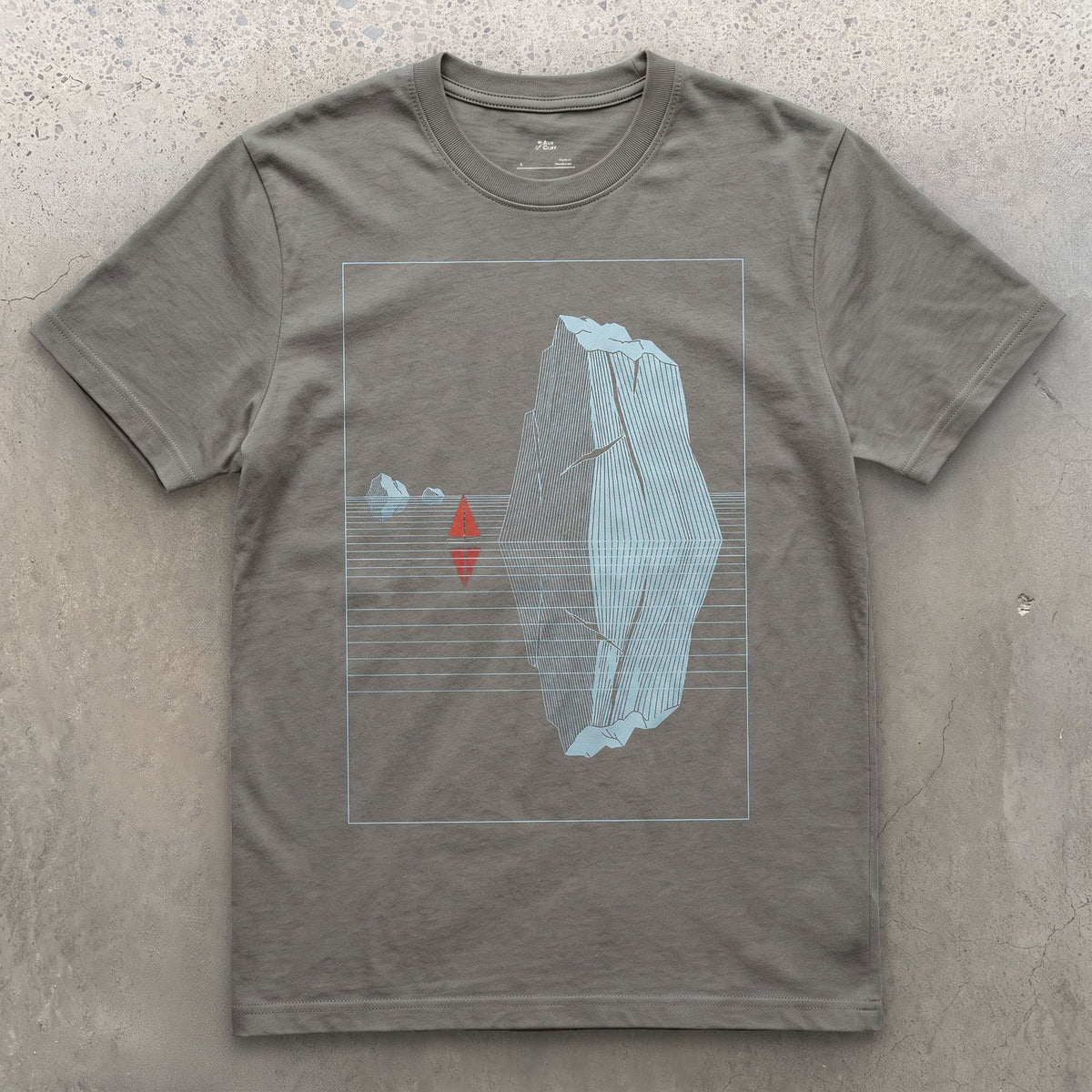 Small Boat, Glacier Iceberg Twice Its Size design on a Charcoal Gildan Softstyle t-shirt