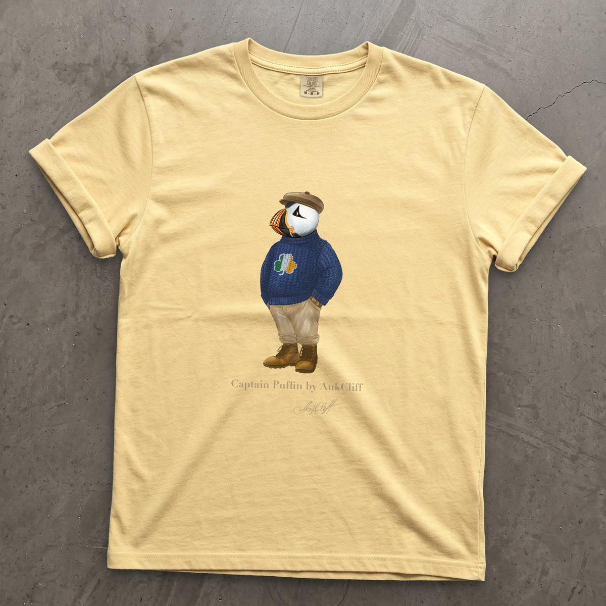 Captain Puffin Irish Trailkeeper on a Butter Comfort Colors t-shirt