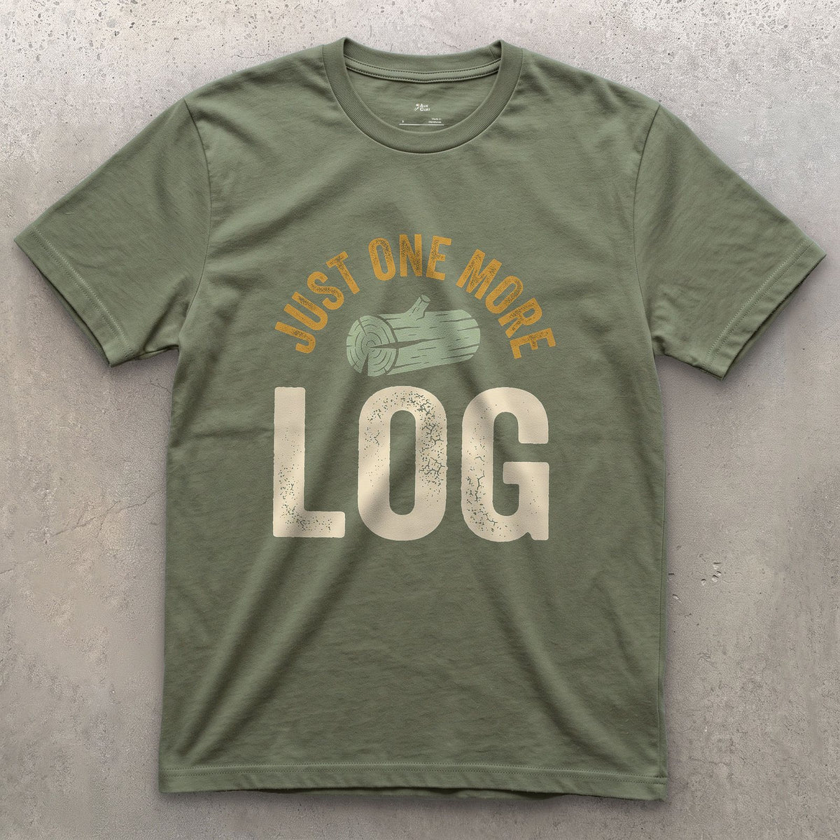 Just One More Log, Firewood Badge design on a Military Green Gildan Softstyle t-shirt