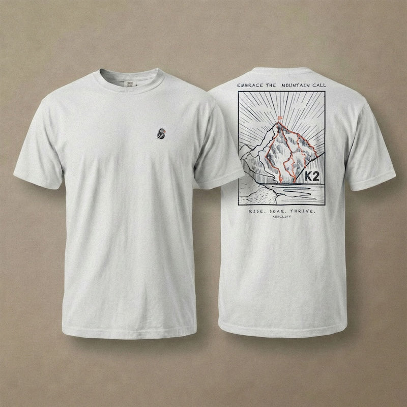 AukCliff K2 tee in White, hand-drawn summit-route line art across the back