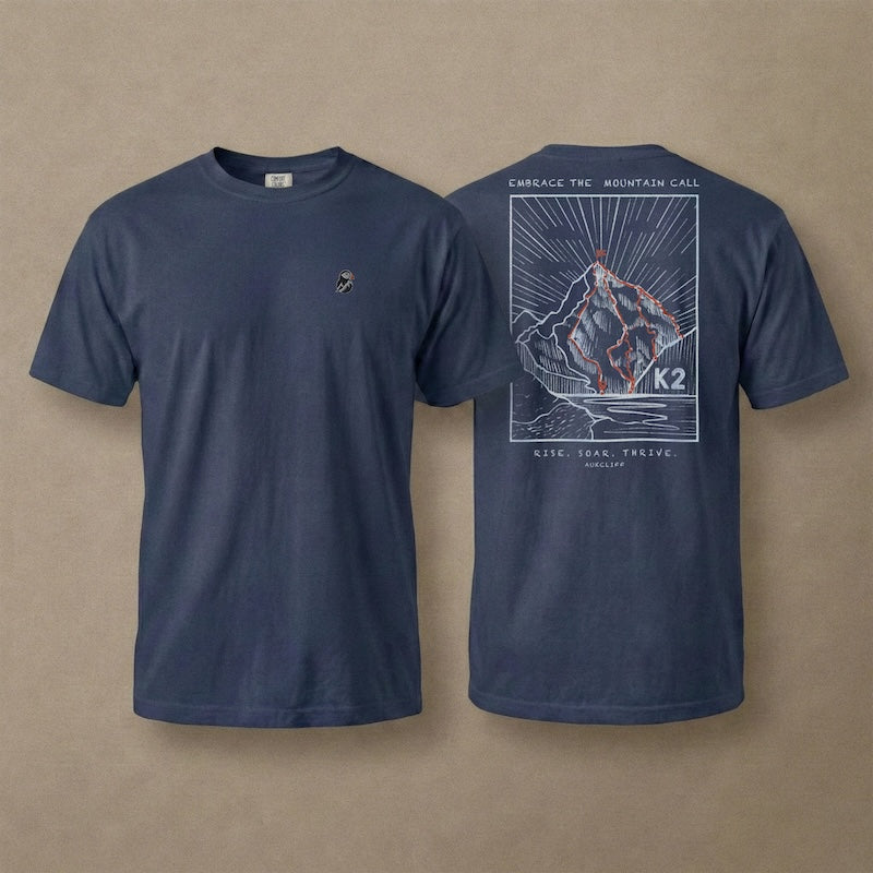 AukCliff K2 tee in True Navy, hand-drawn summit-route line art across the back