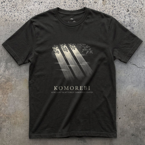 Komorebi, Sunlight Scattered Through Leaves design on a Black Gildan Softstyle t-shirt