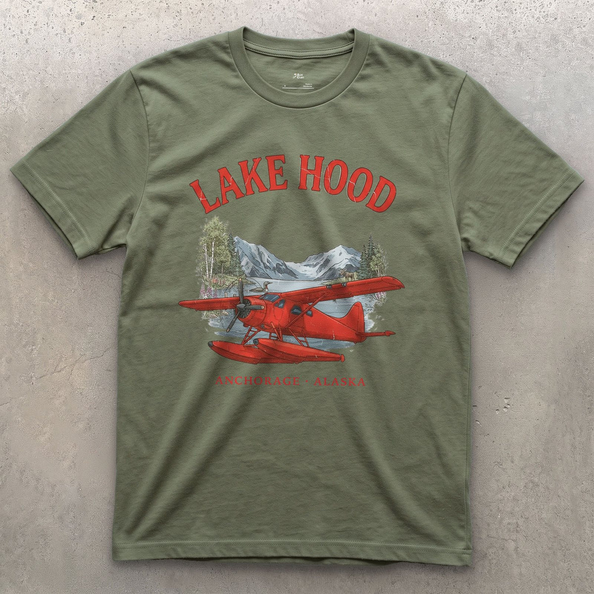 Lake Hood Bush Plane design on a Military Green Gildan Softstyle t-shirt