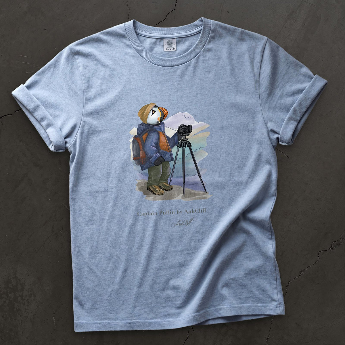 Captain Puffin Landscape Photographer on a Washed Denim Comfort Colors t-shirt
