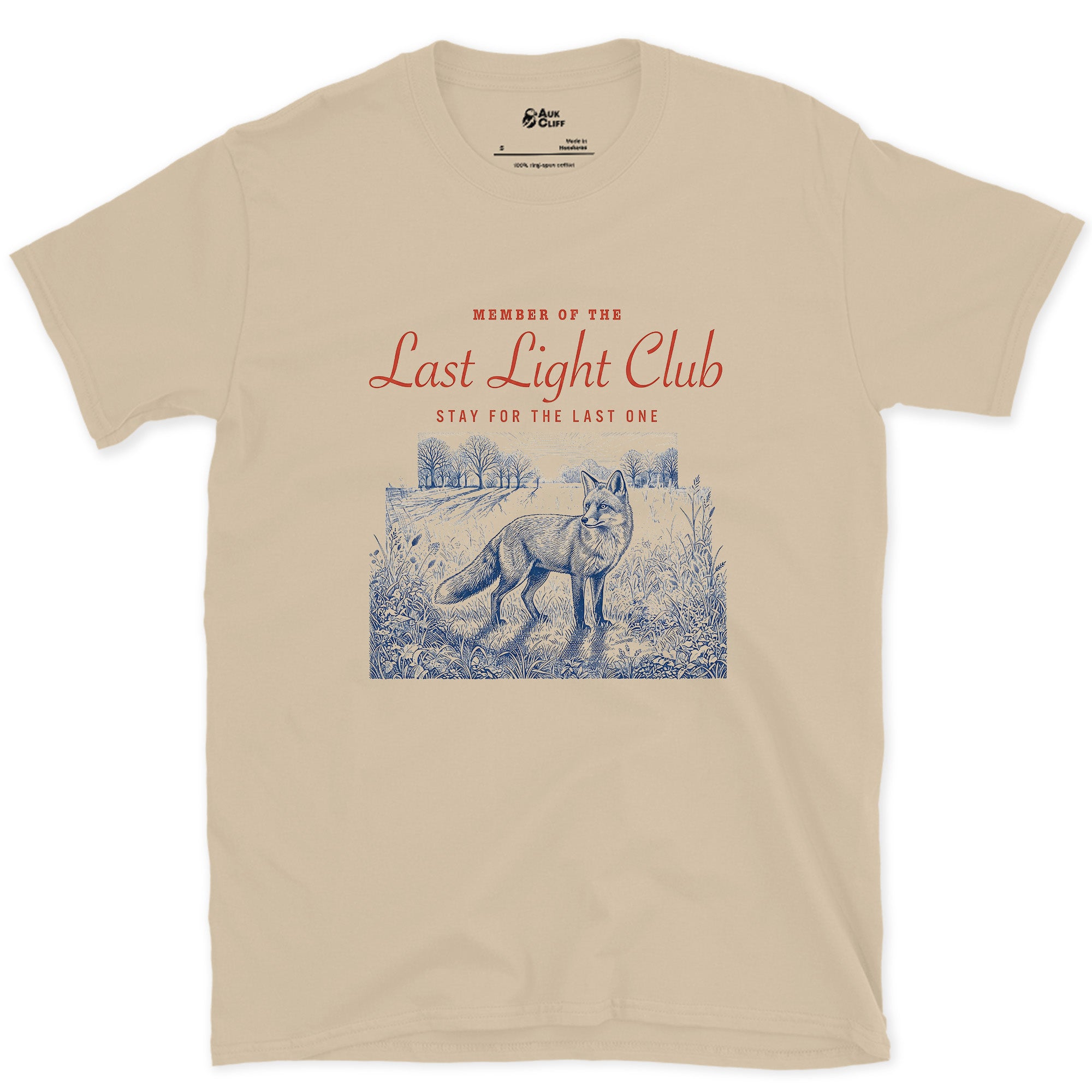Last Light, Stay for the Last One, Coyote in Grass design on a Sand Gildan Softstyle t-shirt