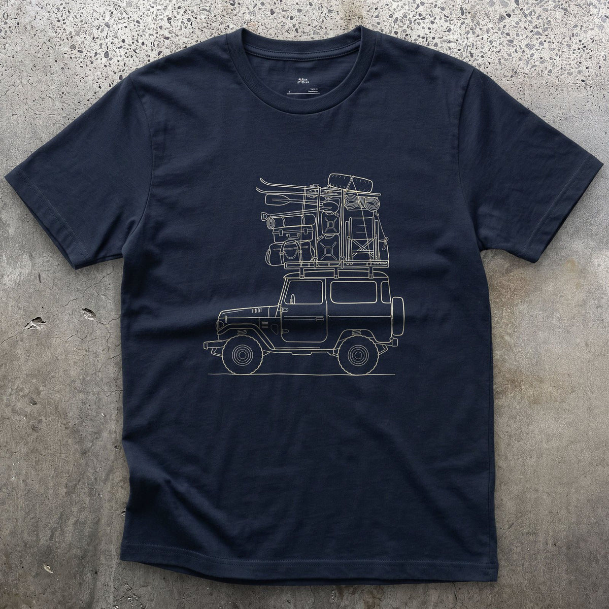 Every Bag Strapped Down on the Wagon design on a Navy Gildan Softstyle t-shirt