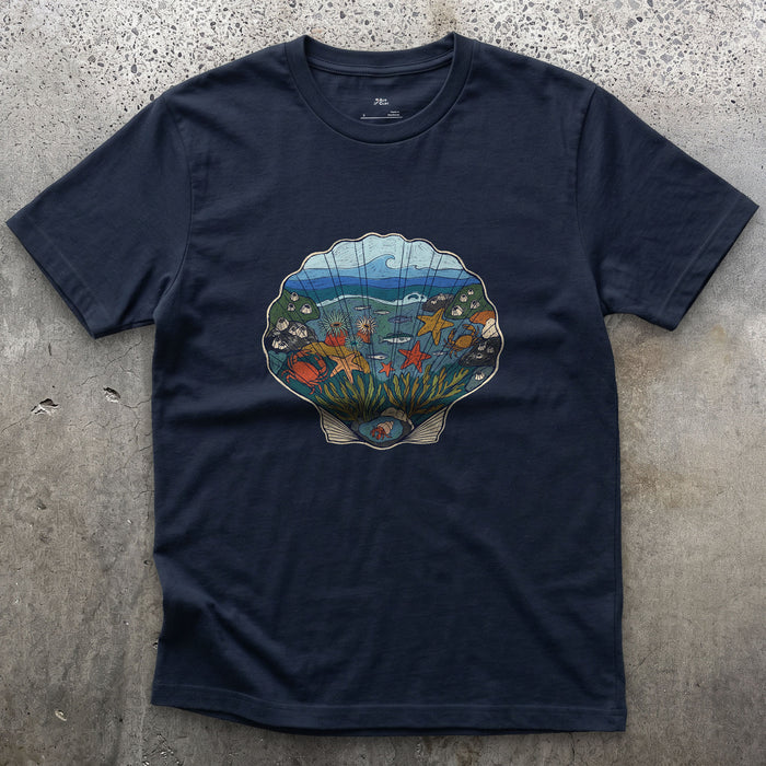 Low Tide in a Scallop Shell design on a Navy Gildan Softstyle t-shirt