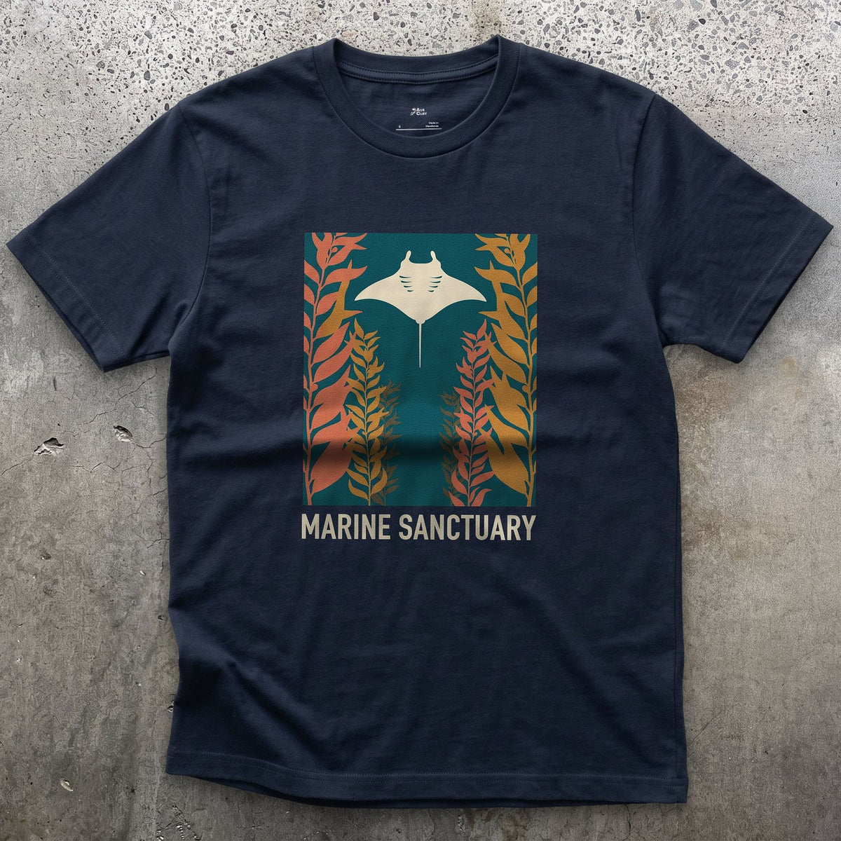 Manta Ray Gliding Through a Kelp Forest design on a Navy Gildan Softstyle t-shirt