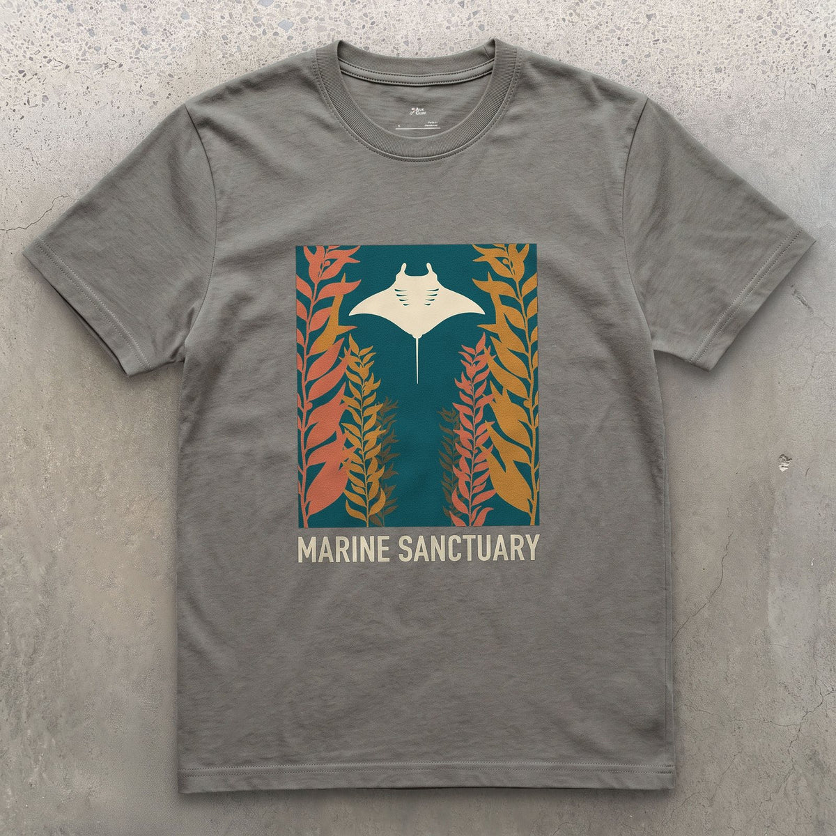 Manta Ray Gliding Through a Kelp Forest design on a Charcoal Gildan Softstyle t-shirt