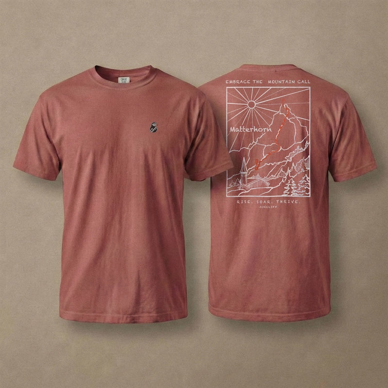 AukCliff Matterhorn tee in Brick, hand-drawn ridgeline line art across the back