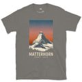 Matterhorn Rises 4478 Metres Above Zermatt design on a Charcoal Gildan Softstyle t-shirt