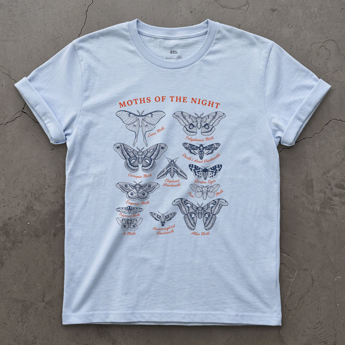 Moths of the Night, a Field Guide design on a Light Blue Gildan Softstyle t-shirt