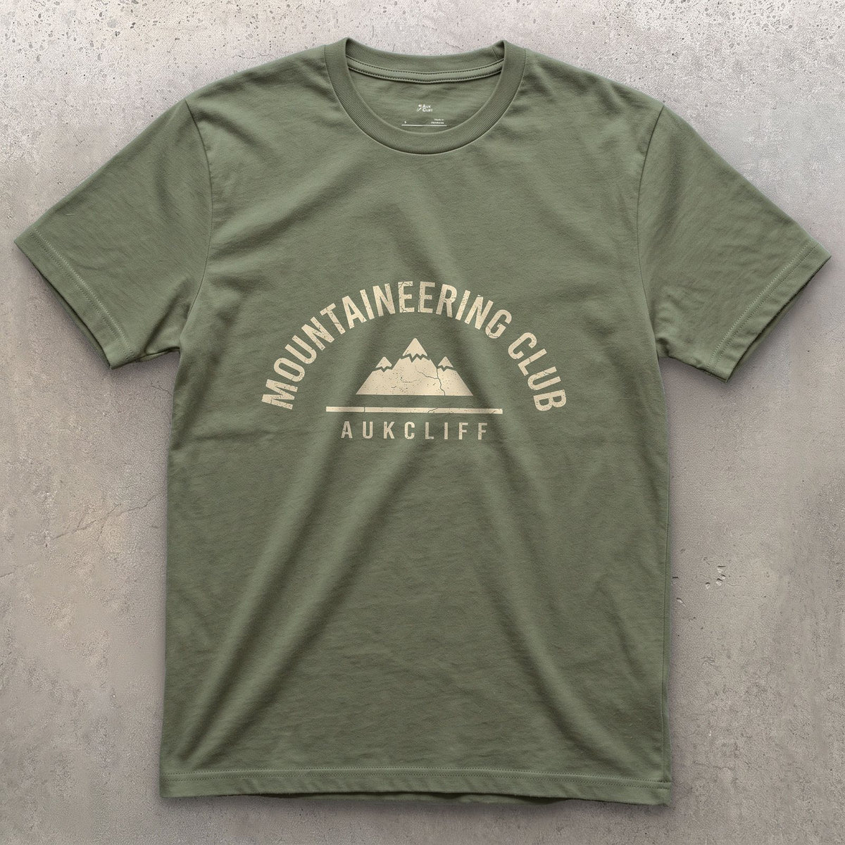 A Patch Earned, Mountaineering Club design on a Military Green Gildan Softstyle t-shirt