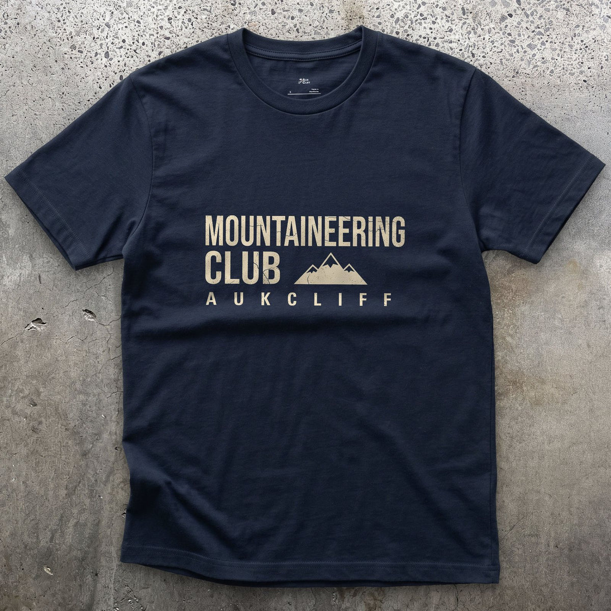 The Mountaineering Club Badge and Peaks design on a Navy Gildan Softstyle t-shirt
