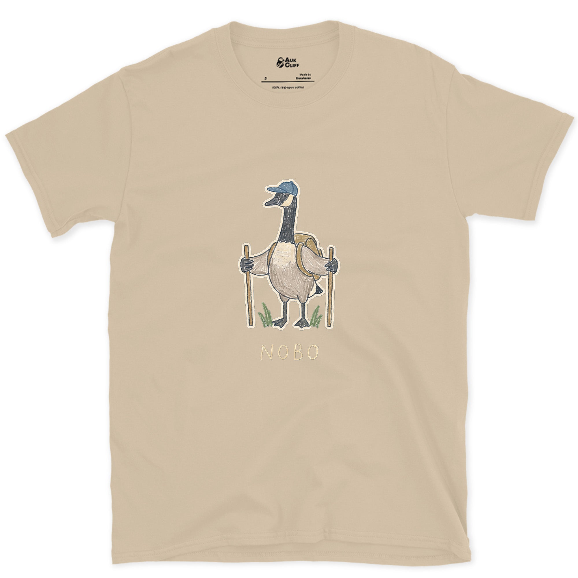 NOBO, Goose Hiker Heading North design on a Sand Gildan Softstyle t-shirt