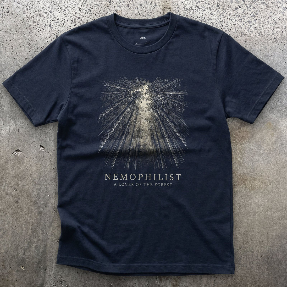 Nemophilist, a Lover of the Forest design on a Navy Gildan Softstyle t-shirt