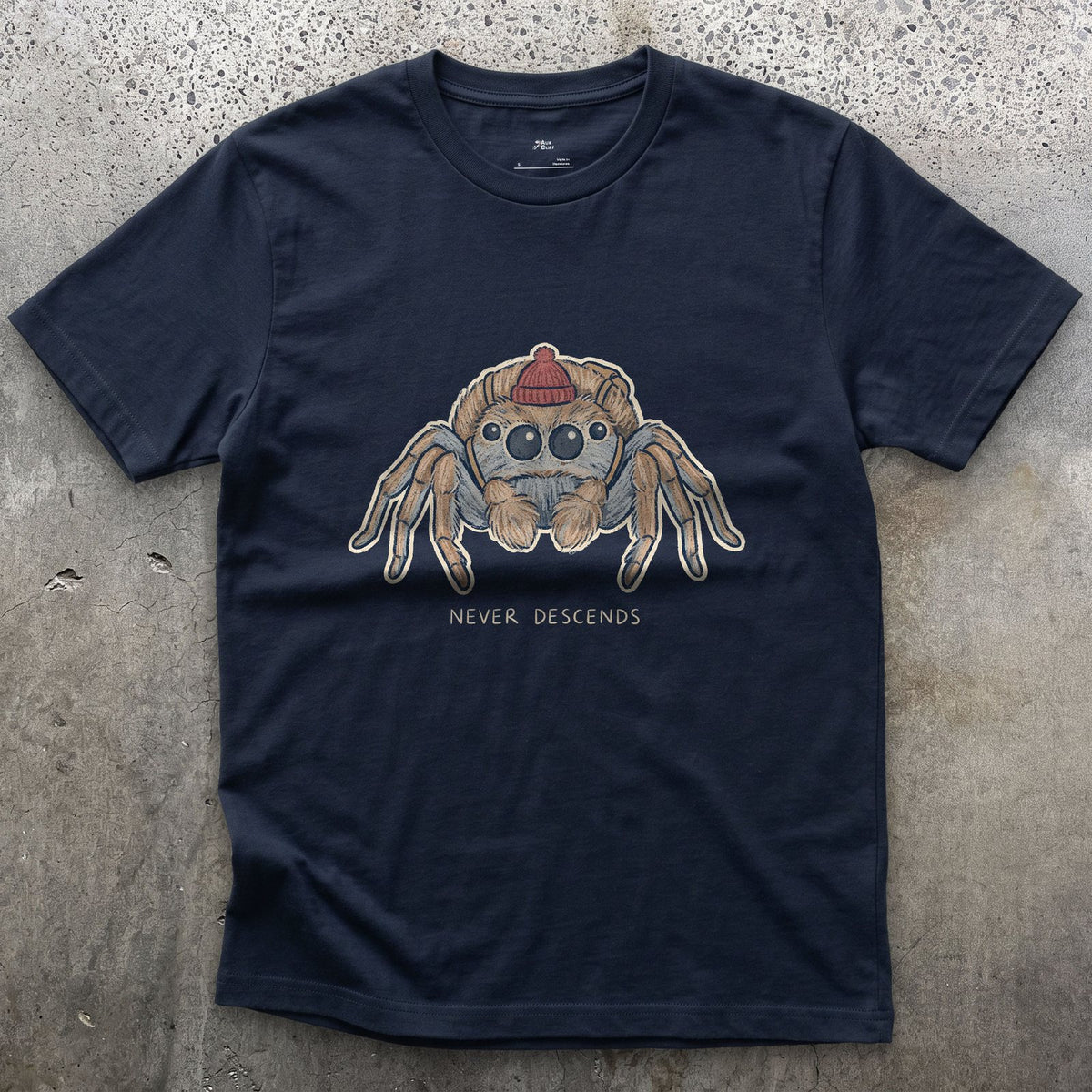 Spider, Climbs but Never Descends design on a Navy Gildan Softstyle t-shirt